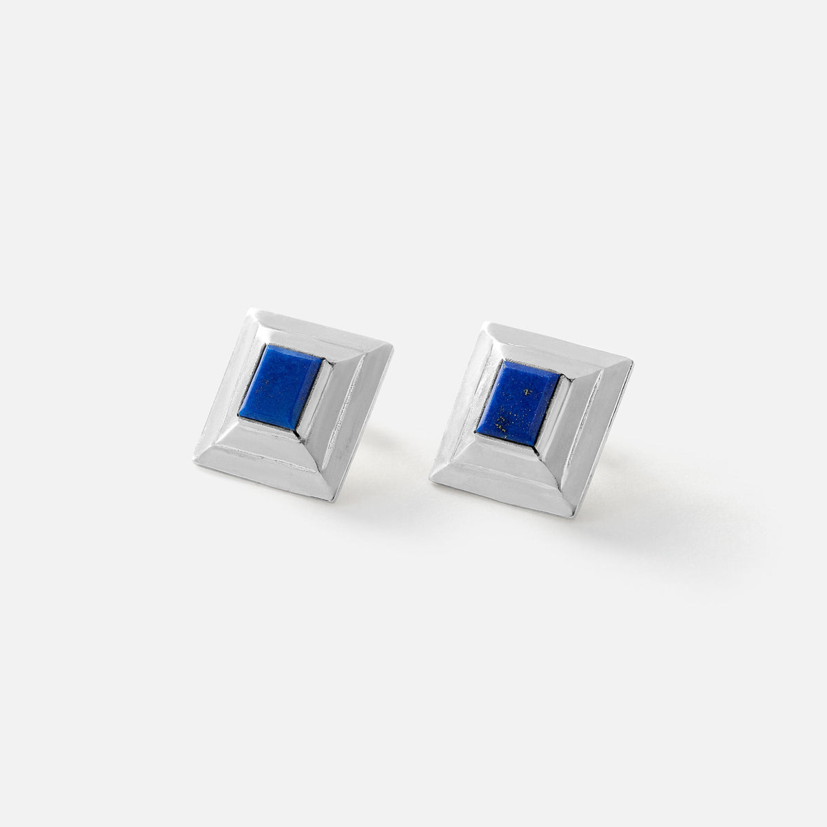 A pair of square silver-toned cufflinks with a recessed blue lapis lazuli crystal center, shown on a clean white background.