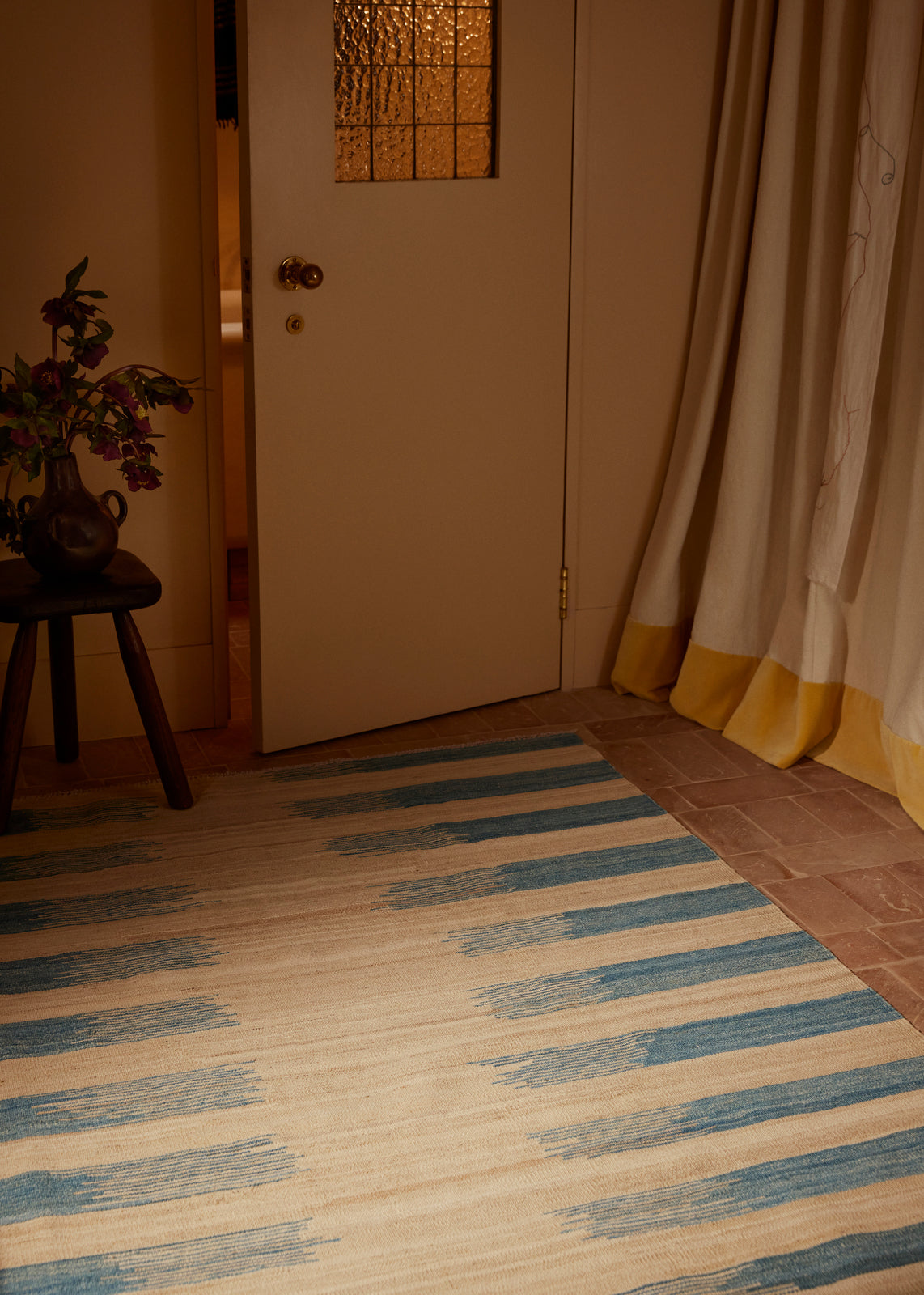 Blue striped handwoven Afghan wool rug lifestyle