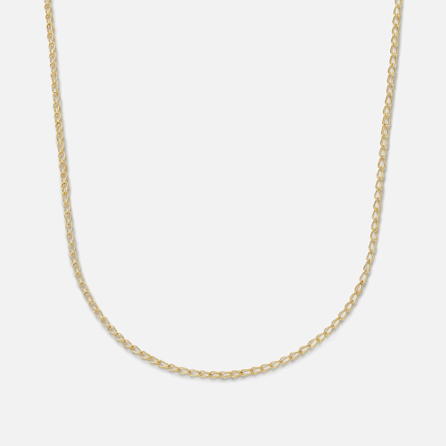 A gold-plated sterling silver handmade chain necklace with a clasp, laid out on a plain background.