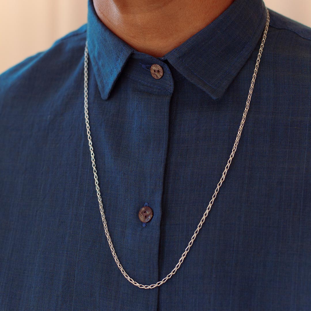 Person wearing handmade sterling silver chain.