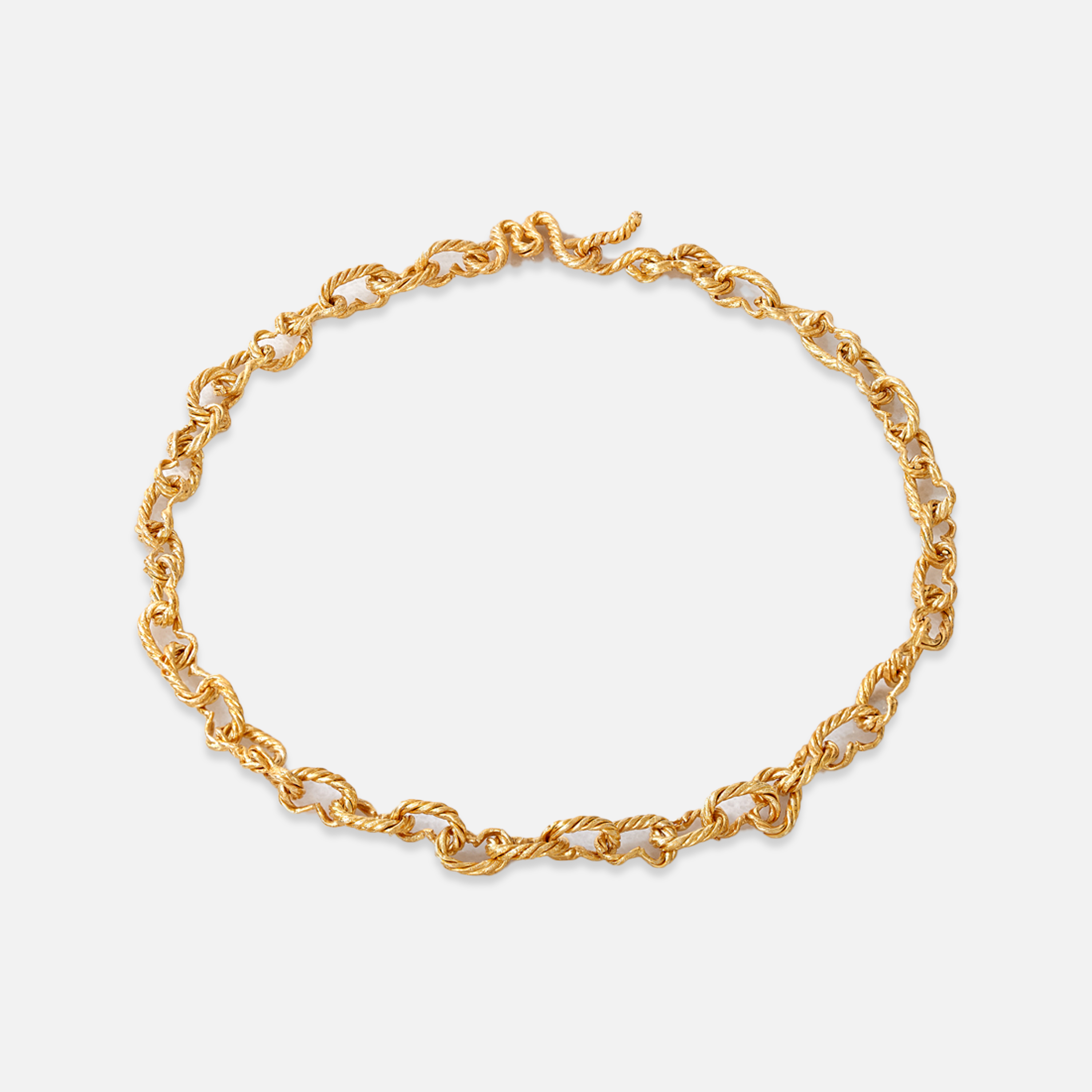 A gold-plated sterling silver choker necklace with a hammered finish and a unique 'M' clasp.