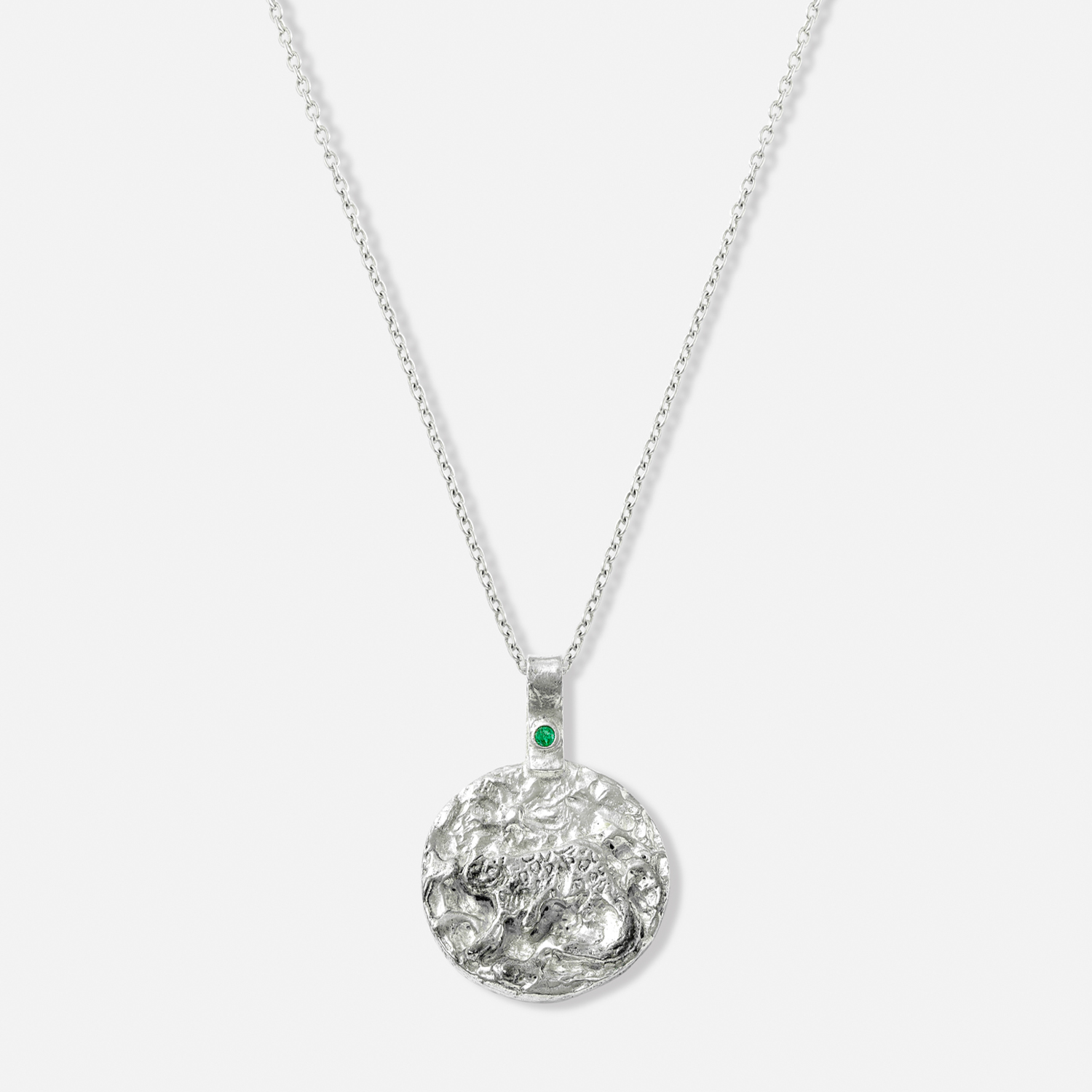 ISHKAR silver necklace featuring a reversible pendant with the snow leopard design on one side.