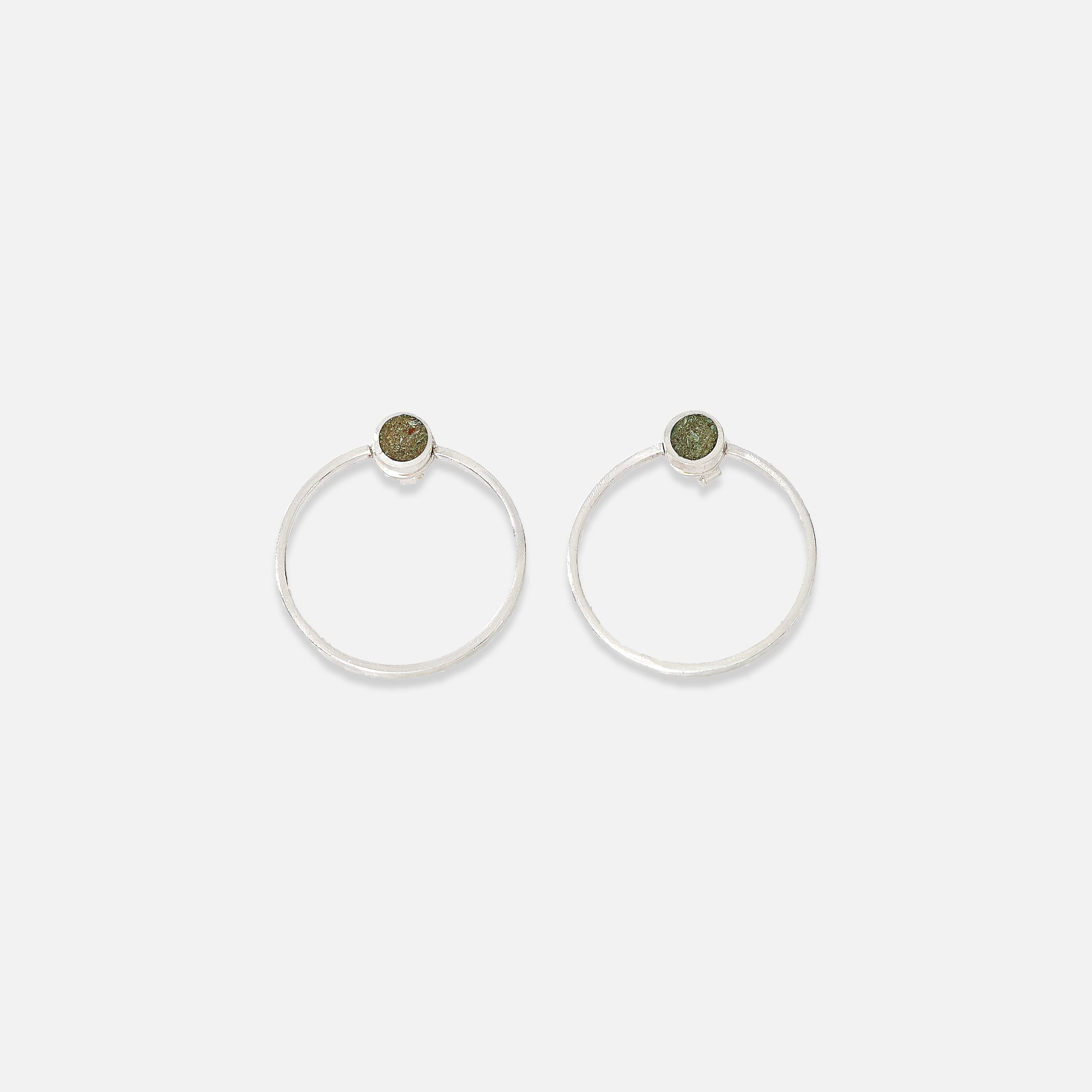 A pair of sterling silver earrings with a Bamiyan turquoise stud detail at the top, displayed against a white background.