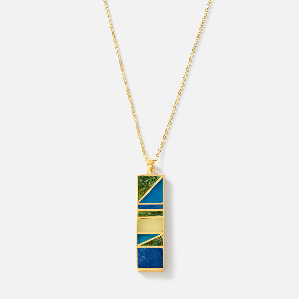 A gold chain necklace with a rectangular pendant featuring a geometric pattern of blue, green, and gold enamel inlay, shown against a light gray background.