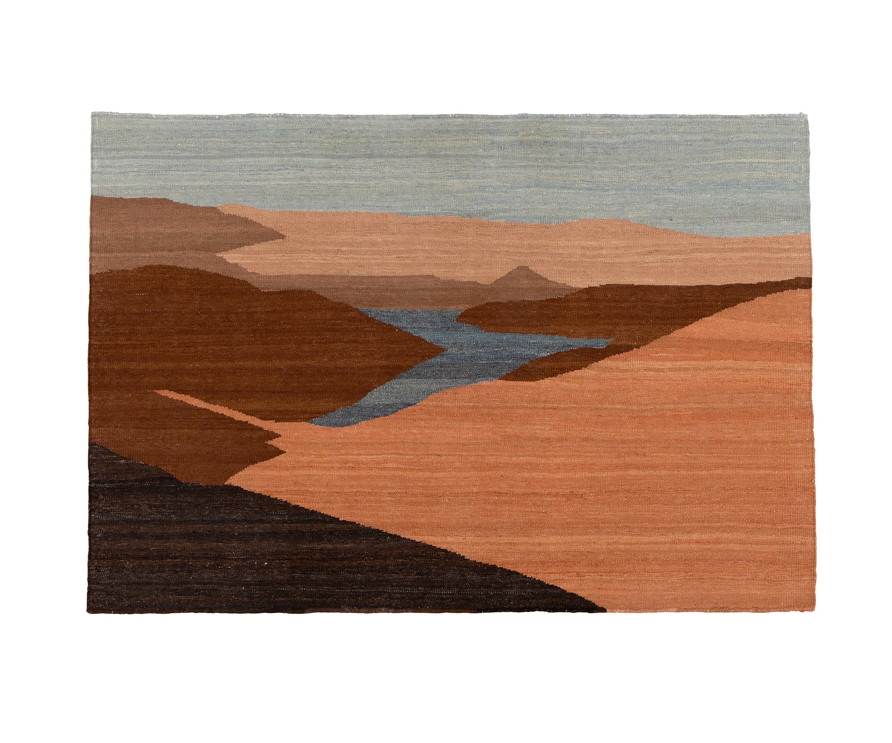 A flatweave rug or tapestry featuring a stylised landscape design with layered terracotta hills, a winding slate-blue river, and a muted blue sky.
