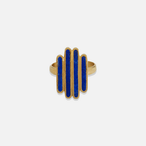 A gold-colored ring with blue lapis lazuli segments arranged in a geometric pattern.