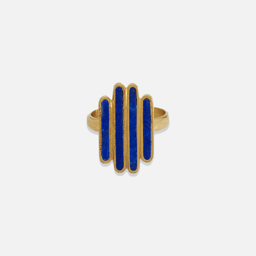 A gold-colored ring with blue lapis lazuli segments arranged in a geometric pattern.