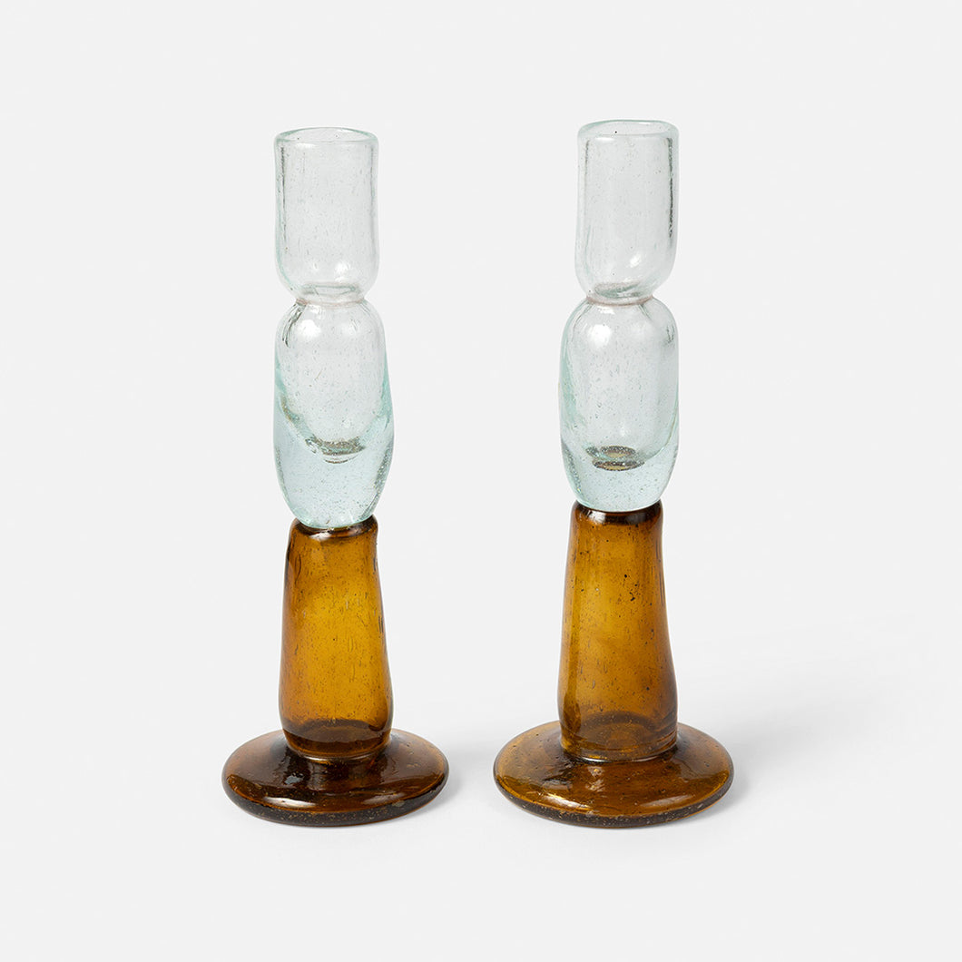 Two tone hand-blown glass candle holders with gold bases and clear tops