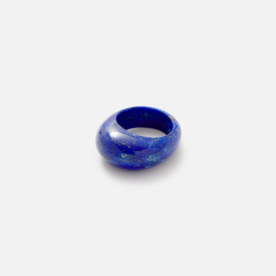 A chunky blue Lapis Lazuli ring with a smooth, solid pattern set on a white background.