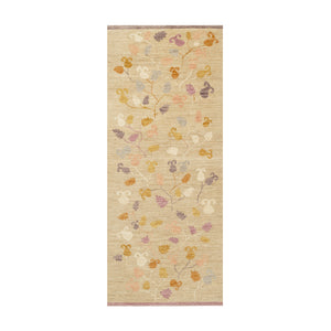 Beige rug with floral pattern on a white background