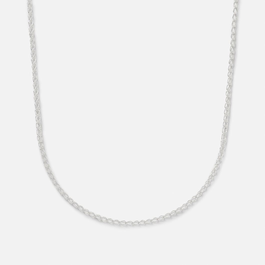 A sterling silver handmade chain necklace with a clasp, laid out on a plain background.