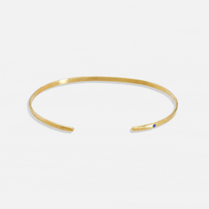 ISHKAR classic oval gold-plated bangle, featuring a small blue gemstone on one end.
