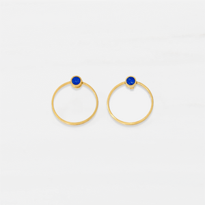 A pair of gold plated sterling silver stud earrings with blue lapis lazuli details in the centre.