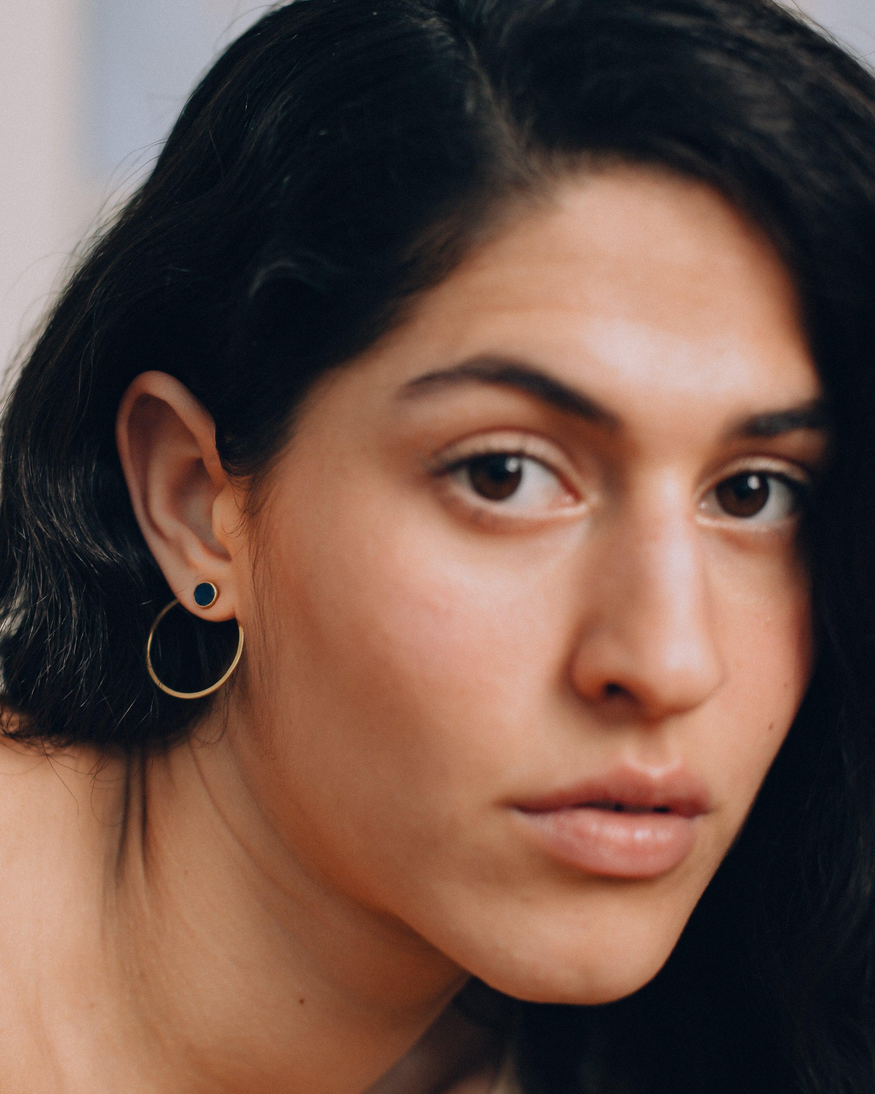 Model wears ISHKAR's small asman studs