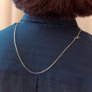 Person wearing handmade sterling silver chain.