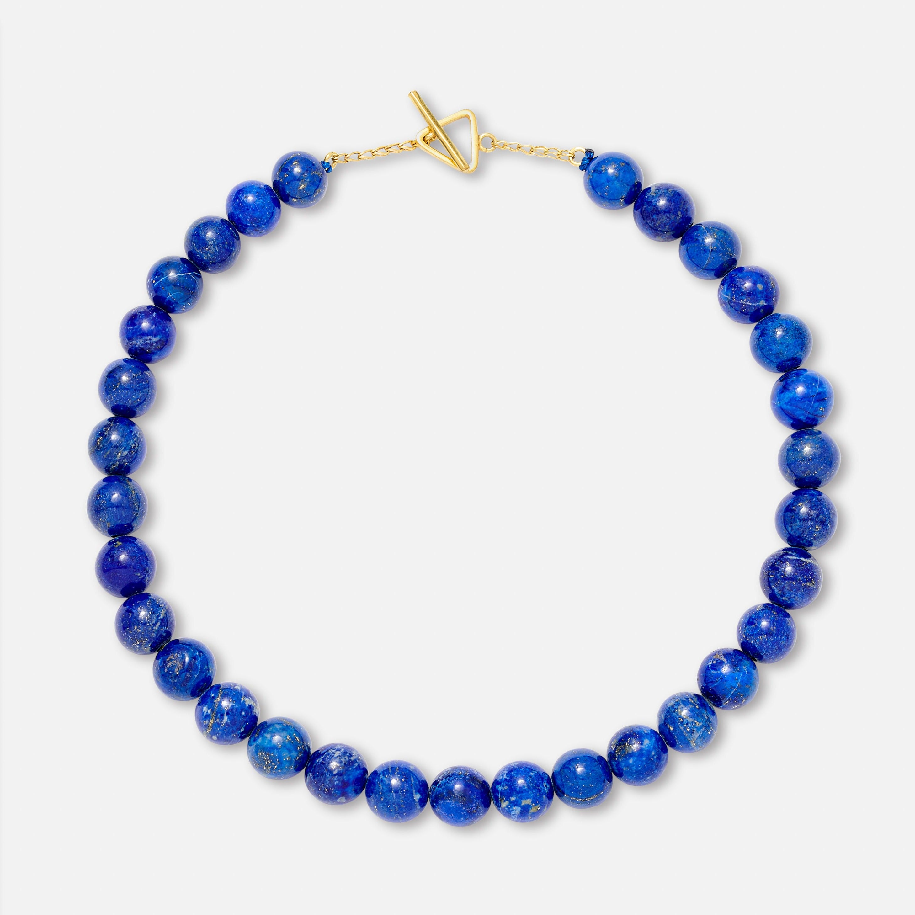A lapis lazuli bead necklace with a gold clasp, displayed against a white background.