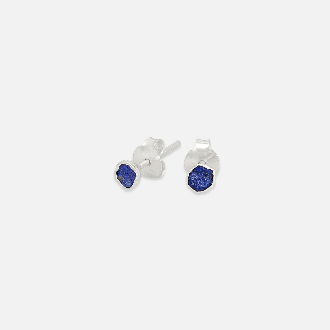 A pair of silver stud earrings with blue Lapis Lazuli inserts, presented against a white background.