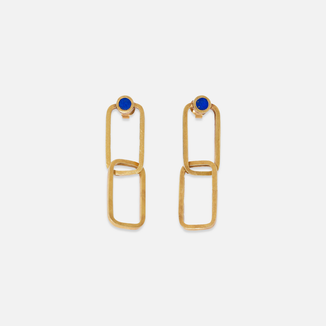 A pair of gold-plated sterling silver earrings with lapis lazuli accents, featuring a geometric design with two connected rectangular shapes and a single blue stone at the top.