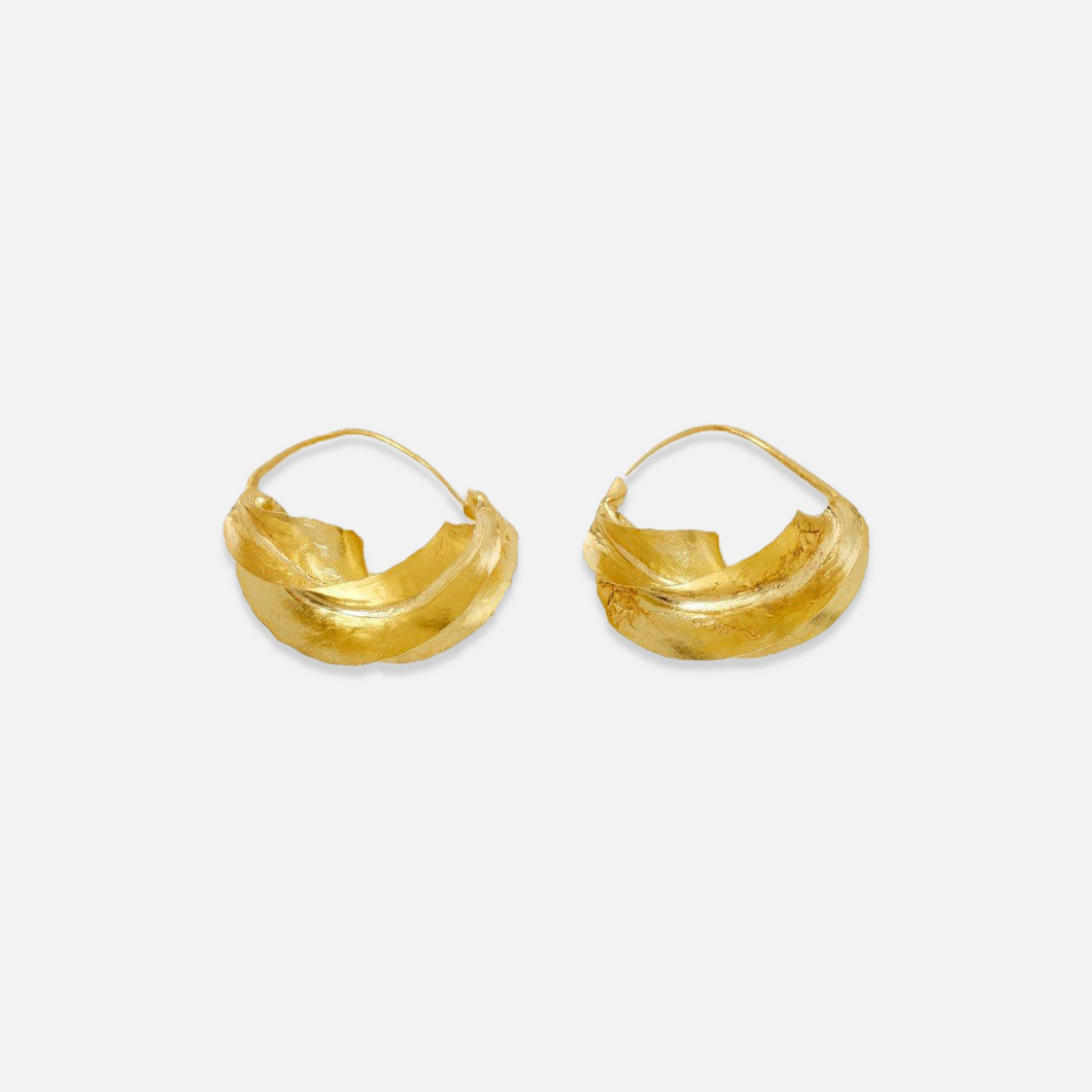 A pair of gold-colored hoop earrings with a twisted design, handcrafted.