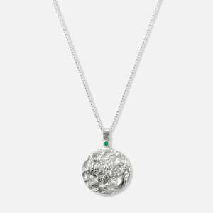 ISHKAR silver necklace featuring a reversible pendant with the snow leopard design on one side.