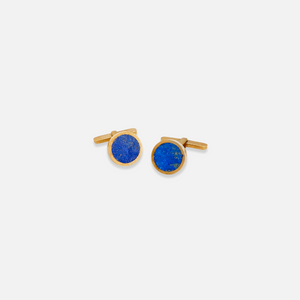 A pair of polished lapis singles cufflinks set against a white background.