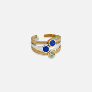 Three adjustable rings with blue lapis lazuli and chrysocolla stones, set against a white background.