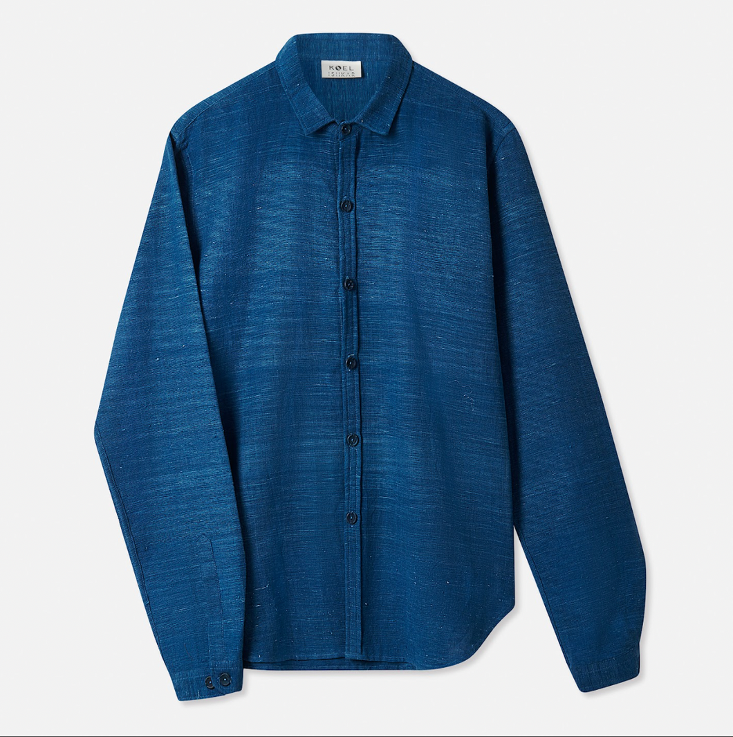 A long-sleeved indigo blue cotton shirt with a classic collar, button-down front, and a curved hem.