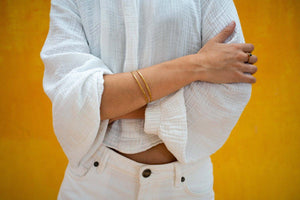 Lifestyle image of ISHKAR's gold-plated bangle.